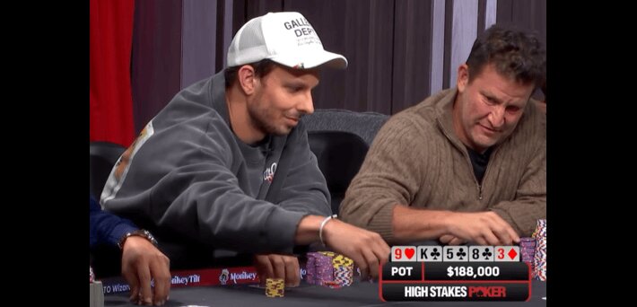 Kiki Senor Tilt Angle shooting, while motioning to put chips in the pot before withdrawing his bet