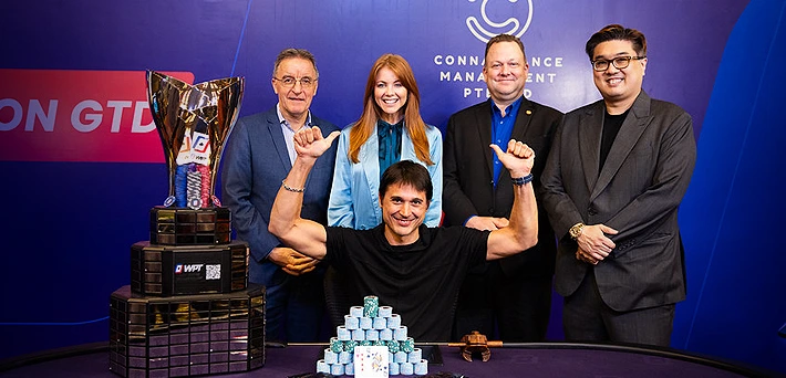 Artem Vezhenkov holding WPT Cambodia 2025 Championship trophy after winning first place